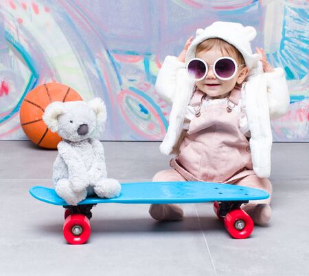 Baby fashion playing on streetの写真素材
