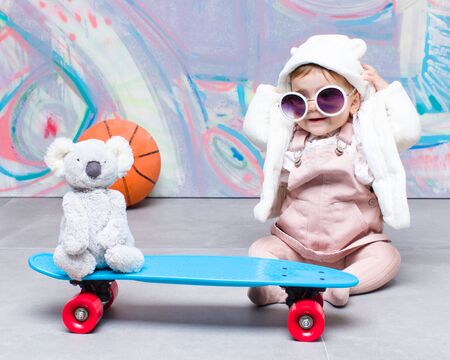 Baby fashion playing on streetの写真素材