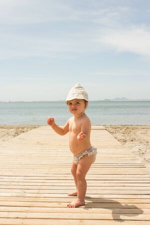 baby in the sea side aloneの写真素材