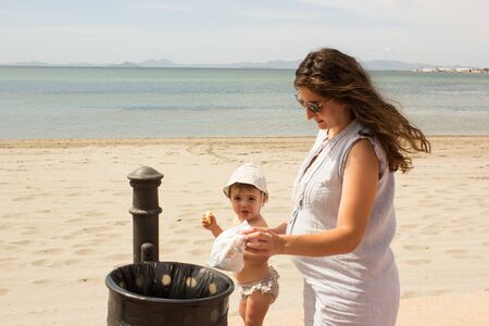 baby with mother in the beachの写真素材