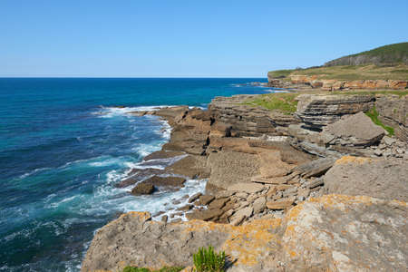Steep cliffs with a turquoise-blue turquoise seaの写真素材