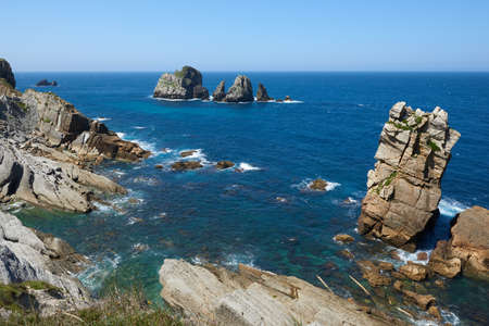 A beautiful view of whimsical rock formations on cliffs in northern Spain.の写真素材