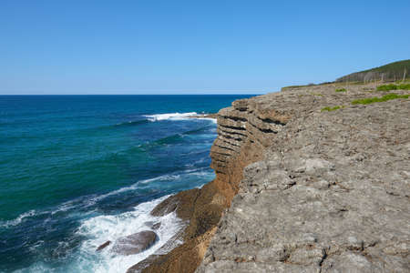 Steep cliffs with a turquoise-blue turquoise seaの写真素材