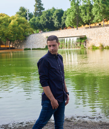 A young model in jeans posing in a relaxed pose.の写真素材