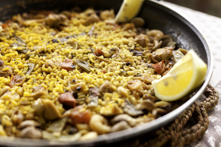 Traditional Spanish paella with seafood and chicken. Prepared in wookの写真素材