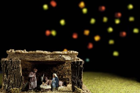 Christmas Manger scene bethlehem portal with figures including Jesus, Mary, Joseph, cow and mule...