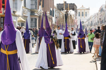 Marchena, SEVILLE, SPAIN - March 25, 2016: Procession of Holy Week(Semana Santa) in Marchena, SEVILLE. Holy Friday. The Nazarenes (penitents) carrying wooden crucifixesのeditorial素材