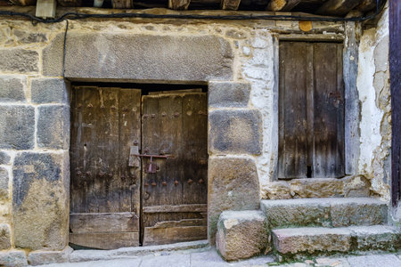 Facade of very old house in medieval village of Salamanca, Spain.の写真素材