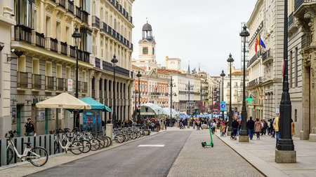 Madrid, Spain, April 9, 2021: Famous Alcala street that enters Madrids Puerta del Sol on a Saturday...