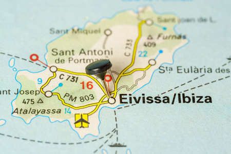 Tourist destination of Ibiza with a pin on a map, macro photo.の写真素材