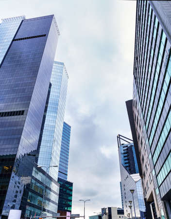 Glass and steel skyscrapers over stormy cloudy sky. Tallinn Estonia.