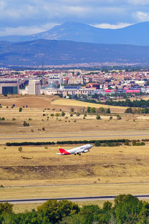 Madrid, Spain, October 30, 2022: Oneworld airline plane taking off from Madrid Barajas airport.のeditorial素材
