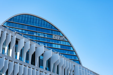 Madrid, Spain, February 4, 2023: BBVA bank headquarters in Madrid on a clear day and blue sky, copyspace.のeditorial素材