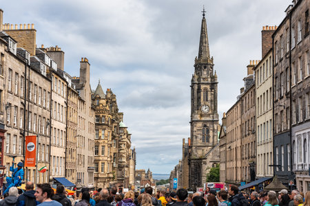 Edinburgh, Scotland, UK, August 22, 2023: the famous Royal Mile street crowded with people and tourists strolling.のeditorial素材