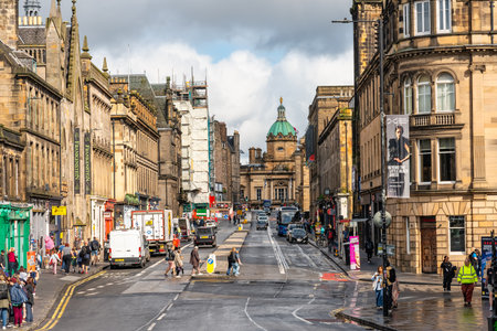 Edinburgh, Scotland, UK, August 22, 2023: Street with people and car traffic in the medieval city of Edinburghのeditorial素材