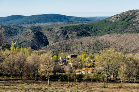 Mountain village on the side of a hill in the Sierra Norte of Guadalajara, Castilla la Mancha.の写真素材