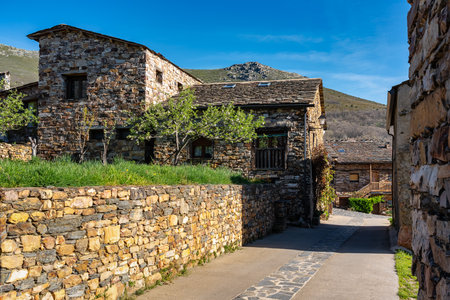 Picturesque streets with stone houses next to the mountains in Guadalajara, Valverde.の写真素材