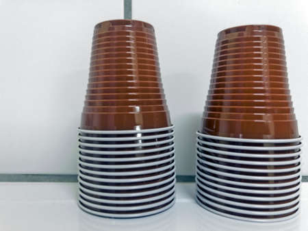 Disposable brown cups on white backgroundの写真素材