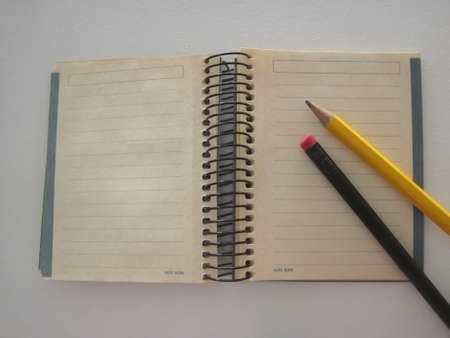 pencil on top of the notebook