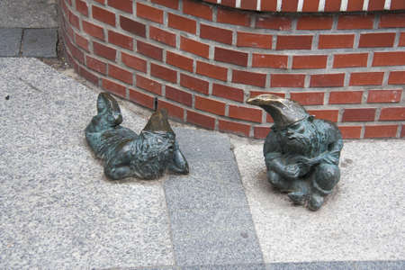 Statue of dwarf, Wroclaw, Poland, man who sings and man who singsのeditorial素材