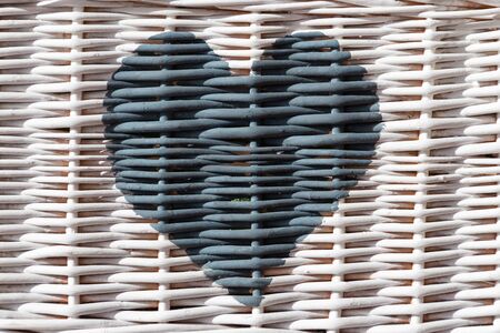 blue heart painted on white wickerの写真素材