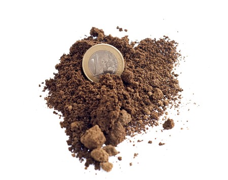 One european coin on the groundの写真素材