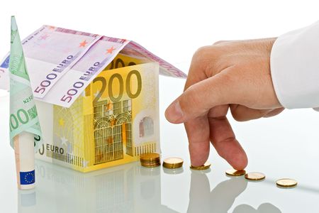 House made of money on a reflection surfaceの写真素材
