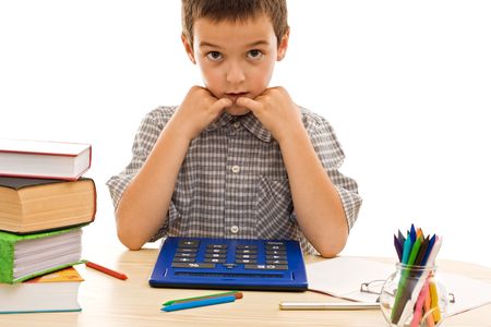 Schoolboy using a calculator for study - isolatedの写真素材