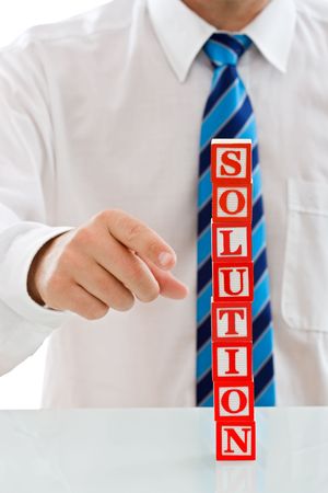 Businessman holding the SOLUTION sign - isolatedの写真素材