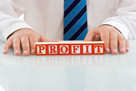 Businessman holding the PROFIT signの写真素材