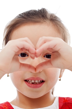 Little girl making heart shape with her handsの写真素材