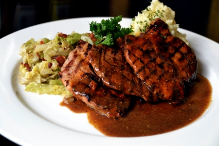 pork chops with cabbage and mashed potatoの写真素材