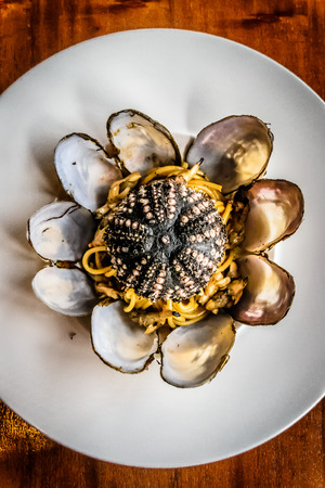Spaghetti with Sunset Clams and Sea Urchinの写真素材