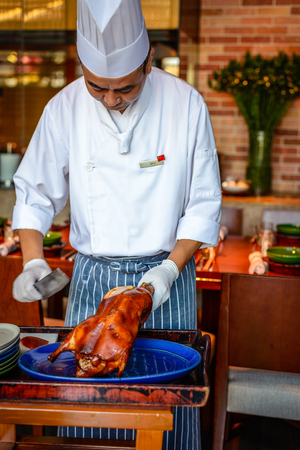 Chinese Chef chopping serving  Peking duckのeditorial素材