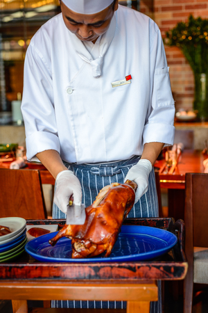 Chinese Chef chopping serving  Peking duckのeditorial素材