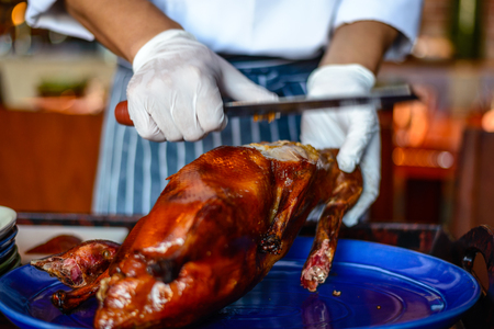 Chinese Chef chopping serving  Peking duckの写真素材