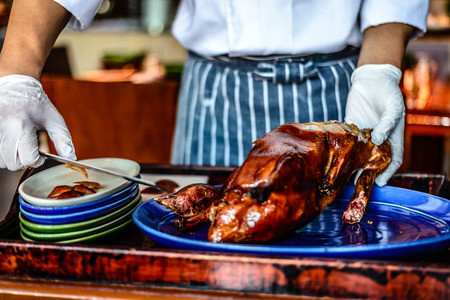 Chinese Chef chopping serving  Peking duckの写真素材