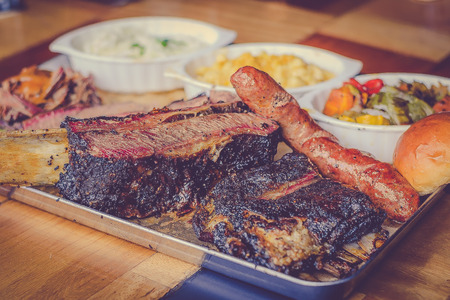 Authentic Texan American Smoke Barbecue Meat with Side dishes Coleslaw Macaroni and cheeseの写真素材