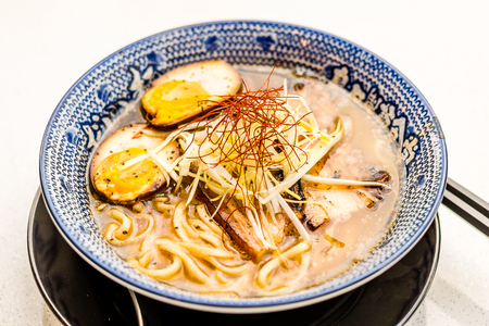 Umami Ramen with soft-boiled egg with char siew and bean sproutsの写真素材