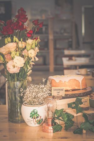 delcicious decorated  display of cakes, cookies, scones and confections in a bakeryの写真素材