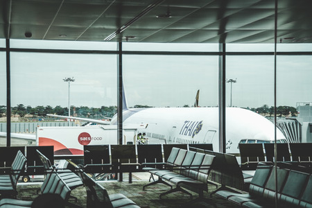 thai airways boeing 777 airplane parked in Singapore Changi Airport Terminal oneのeditorial素材