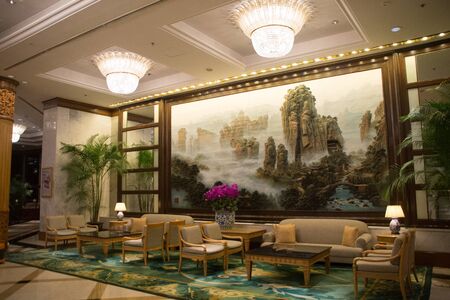 beautiful sitting area with beautiful carpet and chinese painting in the backgroundの写真素材