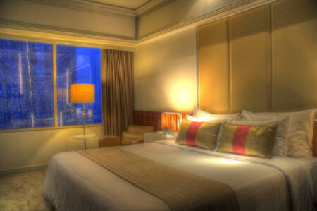 beautiful bedroom in condomunium, apartment, house with double bed and lighting and furnishingsの写真素材
