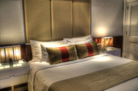 beautiful bedroom in condomunium, apartment, house with double bed and lighting and furnishingsの写真素材