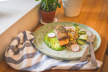 Sous vide miso salmon and avocado served with quinoa edamame saladの写真素材