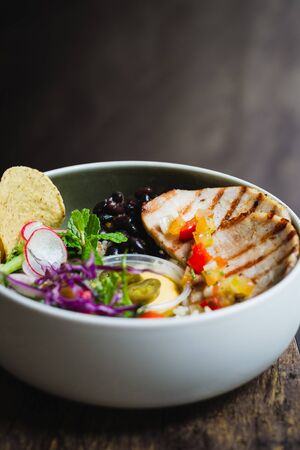 Cerdo Bowl of Roasted pork, pilaf rice, black beans, salad and banana chips