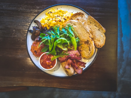 Big Breakfast $24.90Eggs (scrambled/ sunny side up/ omelette), artisanal sourdough, sautÃ©ed tomato, sautÃ©ed mushroom, baked beans, pork sausage, bacon and saladの写真素材