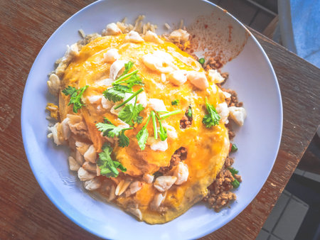 Thai Basil Pork and Crab Omelette Rice with coriander on top