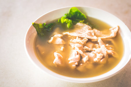sliced lean pork with lettuce in a peppery pork soupの写真素材
