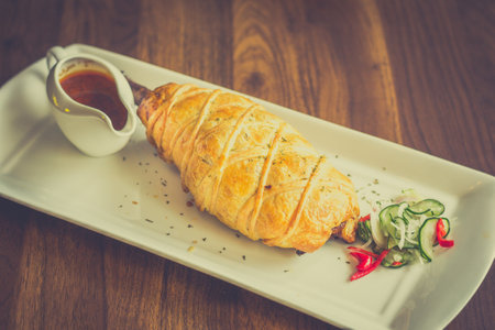 Slow-cooked, fall off the bone lamb shank rendang wellinton encrusted in buttery pastryの写真素材